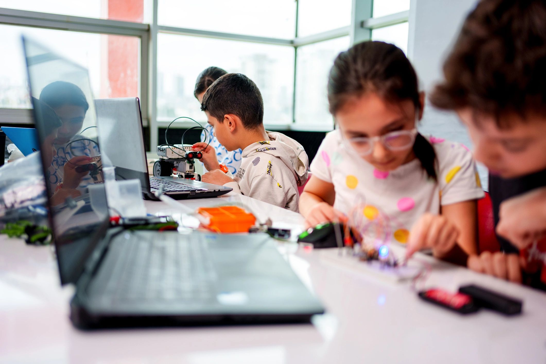 Children collaborating in a hands-on STEM classroom activity